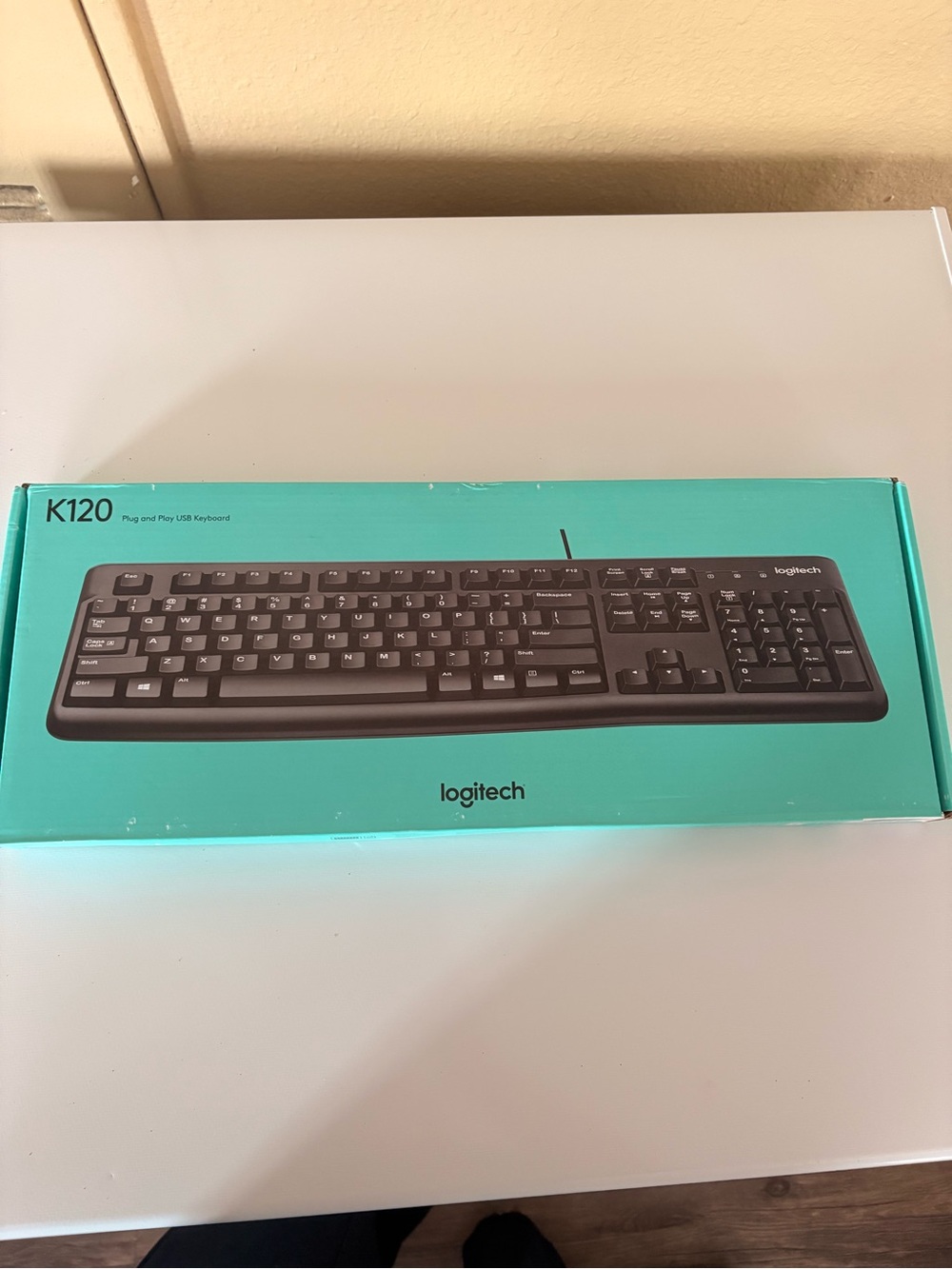 Logitech K120 Full-Size Wired Keyboard — Black Keys on Teal Box
